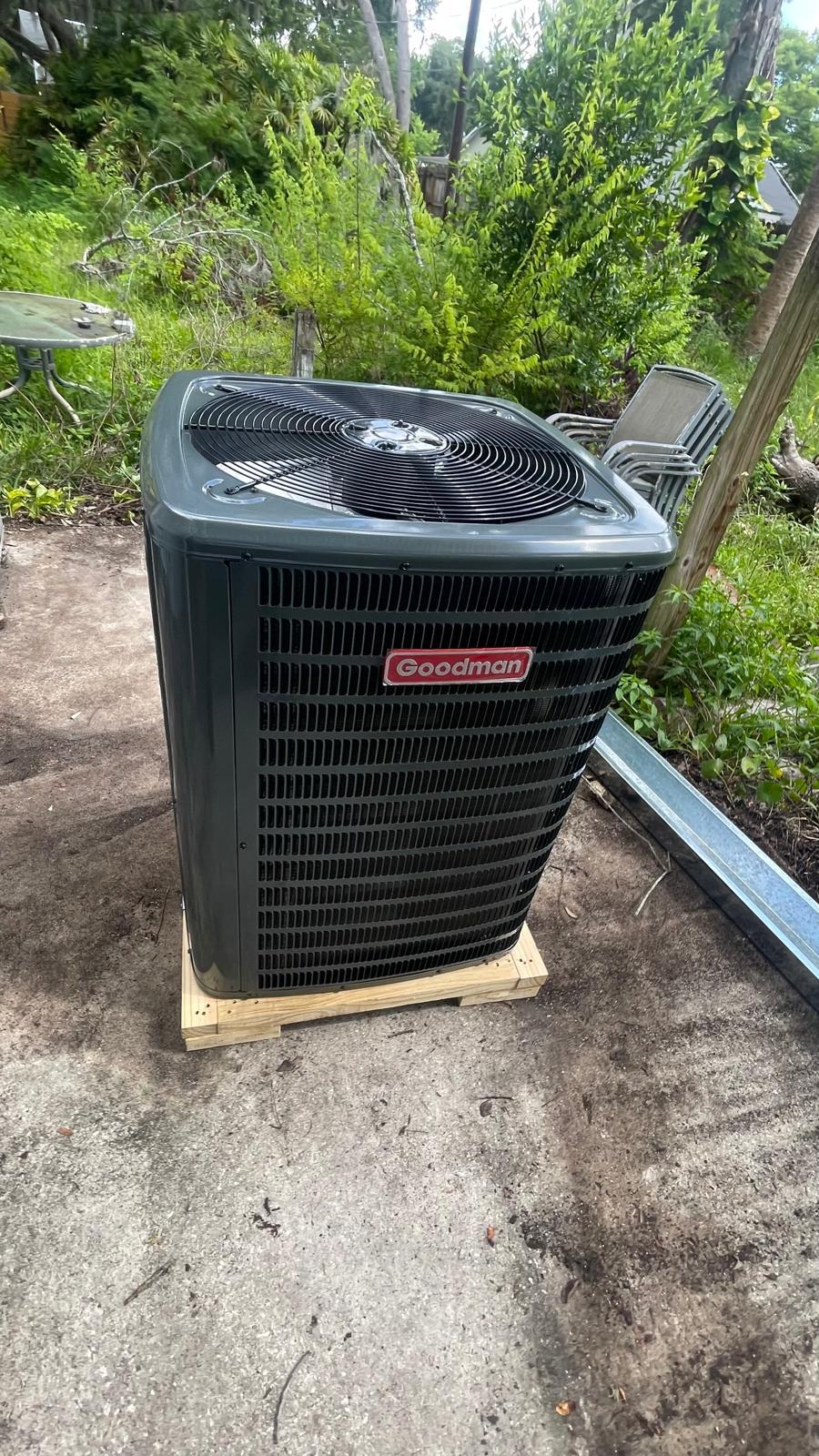 Freshly installed Goodman AC condenser in a Tampa residential backyard