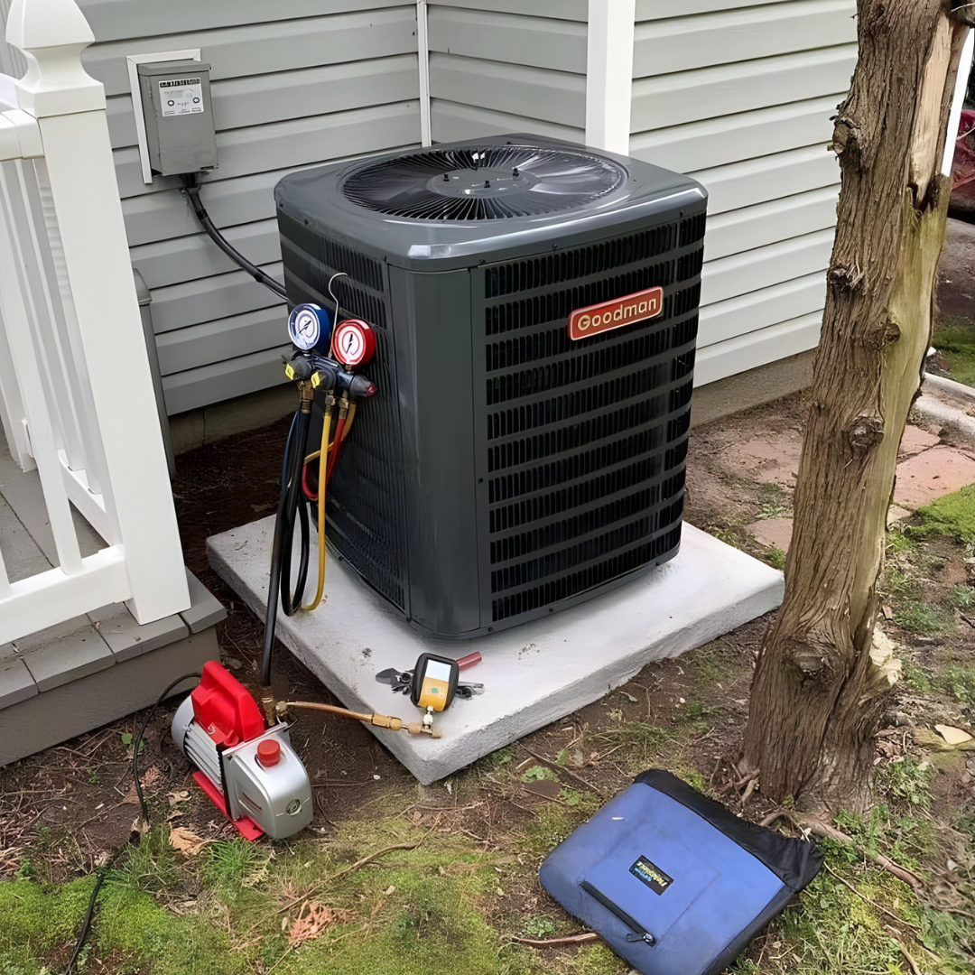 HVAC technician evacuating refrigerant lines during a Goodman AC install